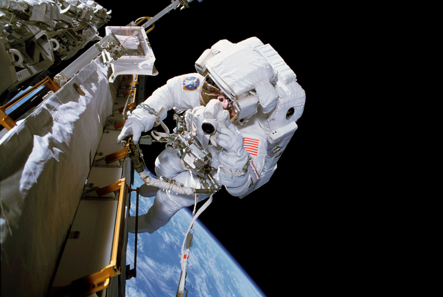 Astronaut doing space walk outside the ISS